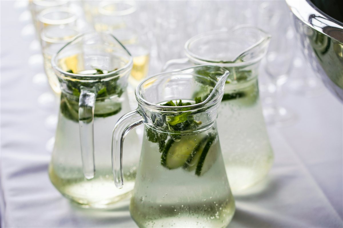A pitcher of infused water with lemon mint and cucumber