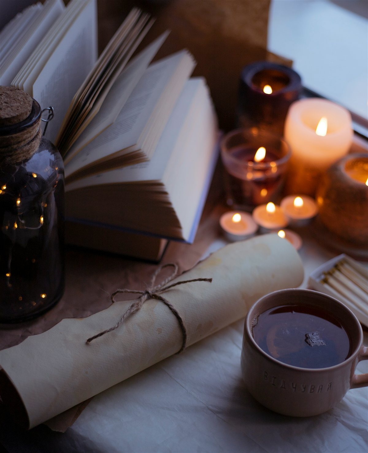 A calming bedside scene with herbal tea and candlelight