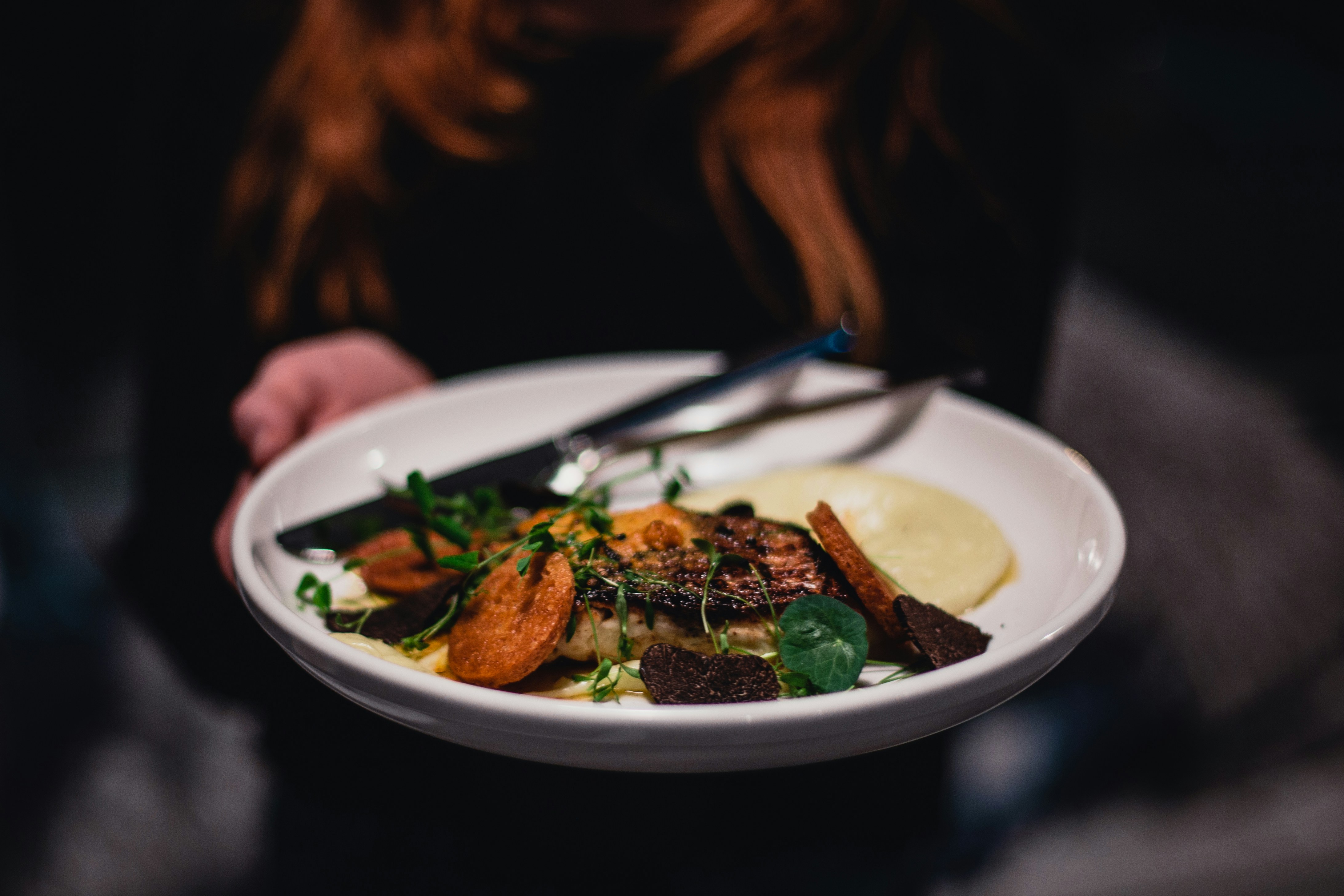 A nourishing evening scene with calming food and herbal tea supporting restful sleep